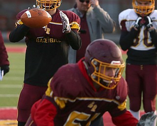 Aniello Buzzacco (14) catches the snap before handing the ball off during a post-season practice, Tuesday, Nov. 21, 2017, at South Range High School in Canfield...(Nikos Frazier | The Vindicator)