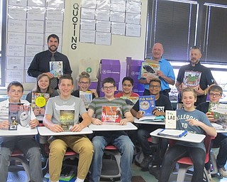 Neighbors | Zack Shively.Scott Lenhart's class at Boardman Glenwood Junior High School unpackaged books donated from Boardman Subaru as a part of Suburu Loves Learning program on Oct. 4. Subaru donated 150 science books to Boardman High School. Pictured are, from left, (front) Justin Yocum, Joseph Sferra, William Parker, Devont Montford, Thomas George; (middle) Olivia Garland, Victoria Colovos, Adam Mohammad, Daniel Gordiejew; (back) Scott Lenhart, Rob Fellman and Donnie Nameth. Fellman and Nameth are members of Boardman Subaru's staff.