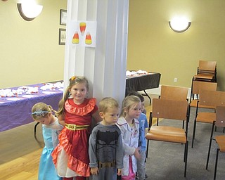 Neighbors | Zack Shively.The children played "four pillars" at the Poland library's Halloween Costume Ball. Librarian Amanda Koller placed four pictures on the four pillars in the room. The children chose a pillar to stand by. Koller pulled corresponding pictures out of a bag. Those standing by the pillar of the picture she picked lost.