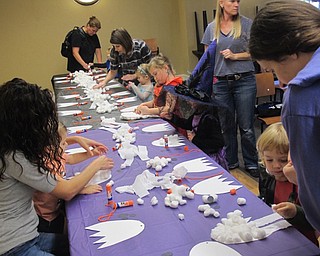Neighbors | Zack Shively.Poland librarian Amanda Koller set up a special craft for the children during the Halloween Costume Ball. The children glued cotton balls to a ghost outline to create a puffy ghost.