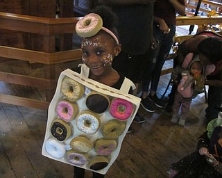 Neighbors | Zack Shively.Carol Vigorito, Recreation and Education Director, organized the event. On the top floor, she brought in a DJ to play music and had dance parties and games for the children. Pictured is the winner of the costume contest that they had.