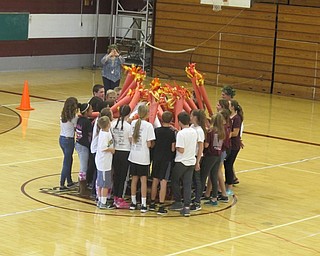 Neighbors | Zack Shively.Boardman Glenwood Junior High students used paper torches to light the Olympic flame to begin their Greek Olympic Games on Oct. 20.