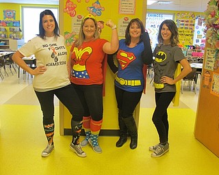 Neighbors | Zack Shively.Austintown Elementary School teachers and staff dressed up along with students for Red Ribbon Week. The school had a different theme for each day. On Oct. 26, the school dressed as super heroes for their day of "Super Heroes Don't Do Drugs." Pictured are, from left, Ashley Wallace, Kristin Havaich, Penny Callahan and Julie Emrich.