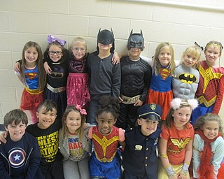 Neighbors | Zack Shively.Austintown Elementary Schools students dressed as their favorite super heroes as a part of their "Super Heroes Don't Do Drugs" day on Oct. 26. Many dressed as comic book characters, but some dressed as police officers or fireman. Second grade teacher Ashley Wallace wore a shirt commemorating her hero Cam Jaros, a student at Austintown currently fighting cancer.