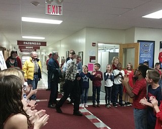 Neighbors | Zack Shively.Robinwood Lane Elementary fourth-grade students lined the hallways after their concert to clap and cheer for the veterans that came to their concert. The school hosted the event to honor the veterans.