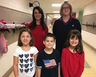 Neighbors | Submitted.Poland Union Elementary teamed with Covelli Enterprises to raise money to help Pioneer Trails Tree Farm pay to ship Christmas trees to troops serving overseas. The school asked children to bring in spare change and raised $429. Covelli Enterprises matched the donation to bring in a total of $858. Representatives from Covelli Enterprises visted the school on Nov. 10. Pictured are Ashlee Mauti and Becke Ballentine with Union students.