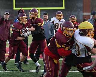 Aniello Buzzacco (14) hands the ball off to Peyton Remish (44) during a post-season practice, Tuesday, Nov. 21, 2017, at South Range High School in Canfield...(Nikos Frazier | The Vindicator)