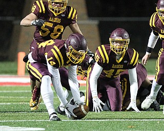 Aniello Buzzacco (14) scoops up a fumble and returns it for a touchdown during the first half of Friday nights matchup against Black River at Canal Fulton.  Dustin Livesay  |  The Vindicator  11/17/17  Canal Fulton.