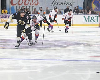 Muskegon Lumberjacks defenseman Bray Crowder (3) and Youngstown Phantoms forward Chase Gresock (19) race towards the puck during the third period of a USHL hockey game, Wednesday, Nov. 22, 2017, at the Covelli Centre in Youngstown. Phantoms won 7-3...(Nikos Frazier | The Vindicator)..