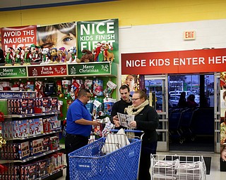The first customers rush into the store during Black Friday shopping, Thursday, Nov. 23, 2017, at the Toys R Us in Boardman...(Nikos Frazier | The Vindicator)