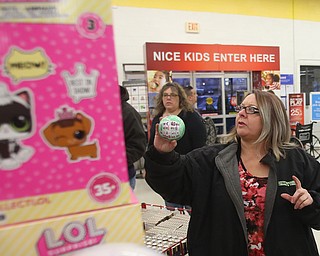 Patti Kountz of Campbell selects a LOL Doll during Black Friday shopping, Thursday, Nov. 23, 2017, at the Toys R Us in Boardman...(Nikos Frazier | The Vindicator)