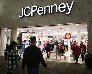 Customers walk in and out of the store during Black Friday shopping, Thursday, Nov. 23, 2017, at JCPenney in Southern Park Mall in Boardman...(Nikos Frazier | The Vindicator)