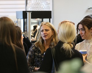 Nanette Lepore(center) and daughter Violet Savage talk with customers during a trunk sale featuring fashion designer Nanette Lepore, Friday, Nov. 24, 2017, at Suzanne's clothing store in Boardman...(Nikos Frazier | The Vindicator)