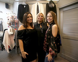 (from left) Maria, Candy and Christina(17) Larocca of Boardman pose for a photo in Nanette Lepore attire during a trunk sale featuring fashion designer Nanette Lepore, Friday, Nov. 24, 2017, at Suzanne's clothing store in Boardman...(Nikos Frazier | The Vindicator)