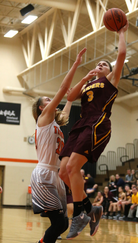 South Range's Izzy Lamparty (3) goes up for a layup against Howland's Alex Ochman (20) during the first quarter of the Toni Ross Spirit Foundation basketball tournament, Saturday, Nov. 25, 2017, at Howland High School in Howland. South Range won 55-51...(Nikos Frazier | The Vindicator)..