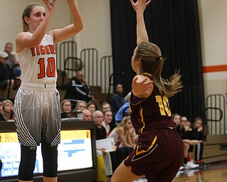 Howland's Gabby Hartzell (10) goes up for three as South Range's Ashley McKee (10) tries to block her shot during the second quarter of the Toni Ross Spirit Foundation basketball tournament, Saturday, Nov. 25, 2017, at Howland High School in Howland. South Range won 55-51...(Nikos Frazier | The Vindicator)..