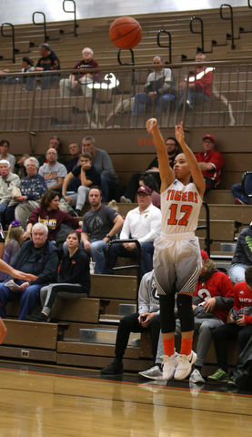 Howland's Ka'Rina Mallory (12) goes up for three during the second quarter of the Toni Ross Spirit Foundation basketball tournament, Saturday, Nov. 25, 2017, at Howland High School in Howland. South Range won 55-51...(Nikos Frazier | The Vindicator)..