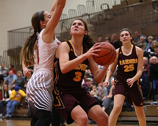 South Range's Izzy Lamparty (3) looks up towards the basket before attempting a layup against Howland's Mackenzie Maze (4) during the third quarter of the Toni Ross Spirit Foundation basketball tournament, Saturday, Nov. 25, 2017, at Howland High School in Howland. South Range won 55-51...(Nikos Frazier | The Vindicator)..