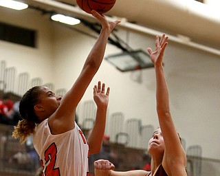 Howland's Ka'Rina Mallory (12) goes up for a layup against South Range's Brooke Sauerwein (20) during the fourth quarter of the Toni Ross Spirit Foundation basketball tournament, Saturday, Nov. 25, 2017, at Howland High School in Howland. South Range won 55-51...(Nikos Frazier | The Vindicator)..