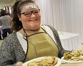 William D. Lewis The Vindicator Emma Garon, 12, of Hubbard serves up Thanksgiving Dinners during a Sunday 11-19-17 community dinner at St Patrick Church in Hubbard.
