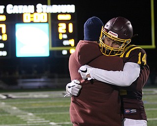 South Range's Aniello Buzzacco (14) gets consoled by his father David Buzzacco after the Raiders loss to Eastwood 21-7 on Friday night .Dustin Livesay |  The Vindicator  11/24/17  Strongsville.