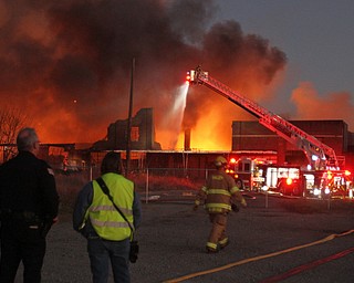 William D. Lewis The Vindicator  Firefighters from several Columbiana County departments respond to a fire at the former Salem China facilty on S. Broadway in Salem Tuesday Nov 28, 2017. Smoke from hte fire could be seen from Austintown.