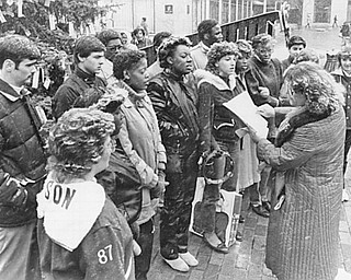 In this undated file photo, the snowflakes seemed to keep time to the music as Kathleen Mecak directed the Rayen-Wilson high school choir in a carol during Friday’s Keep Christ in Christmas program on Federal Plaza.