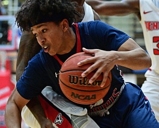 YOUNGSTOWN, OHIO - NOVEMBER 29, 2017: Robert Morris's Leondre Washington attempts to dribble away from the tight pressure from Youngstown State's Braun Hartfield during the second half of their game Wednesday night at Beeghley Center. Robert Morris won 81-74. DAVID DERMER | THE VINDICATOR