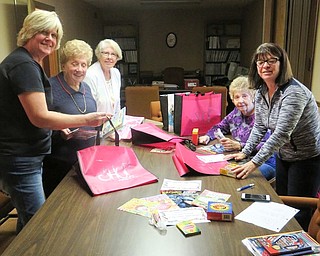 GFWC Ohio Warren Junior Women’s League’s advocates for children committee recently celebrated Advocates for Children Week by assembling 50 Operation Color bags with coloring books and packages of crayons. Above, working on the project, from left, are Diane Taylor; Dorothy Sideropolis; Sue Smith; Edwina Wolcott, chairwoman; and Renee Maiorca, co-chairwoman.
