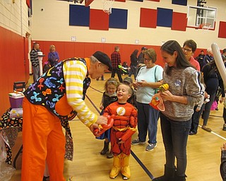 Neighbors | Zack Shively.The Fall Festival at the AES also had an entertainer in the gym. He made balloon animals and swords for the children. They also gave the children some room to play in the gym and outside on the playground.