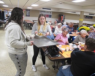 Neighbors | Zack Shively.Along with administration, students of Austintown Fitch High School volunteered their time to give back to senior citizens. The students belonged to the cheerleader squad and National Honors Society.