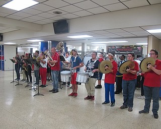 Neighbors | Zack Shively.The Austintown Fitch pep band, under direction of Wesley O'Connor, performed at the Senior Dinner on Oct. 24. Pictured in the center is O'Connor with a marching tuba.