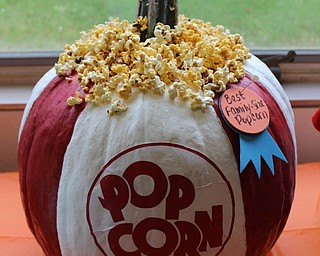 Neighbors | Abby Slanker.One student earned the Best Family Size Popcorn award for this giant decorated pumpkin for the school’s annual pumpkin decorating contest the week before Halloween.