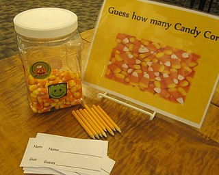 Neighbors | Zack Shively.The children had to guess how many pieces of candy corn a jar held at "Halloween Family Story Time" at the Austintown library. The child who guessed closest to the actual number got to have the jar of candy.