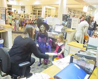Neighbors | Zack Shively.The children walked around the library for trick-or-treating at the Austintown library after story time, crafts and games.