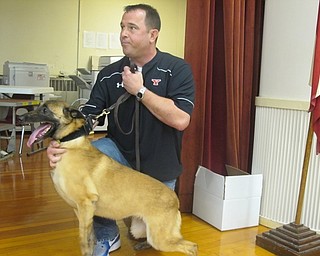 Neighbors | Zack Shively.During Market Street Elementary's Red Ribbon Week assembly, Jeff McLaughin of the Drug Task Force brought the department's K9, Mercy. They did a live demonstration of Mercy searching for drugs. Pictured, Deputy Donnie Blasco held K9 Mercy.