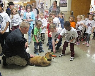 Neighbors | Zack Shively.Upon leaving the assembly, Jeff McLaughlin allowed the students to pet the Drug Task Force's K9, Mercy. The assembly included McLaughlin and Deputy Donnie Blasco discussing the dangers of drugs and giving some statistics on drug use.