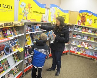 Neighbors | Zack Shively.Parents searched for books to buy at West Boulevard Elementary School's "Family Night" on Nov. 1. The school offered its annual book fair sponsored by the Scholastic Company.
