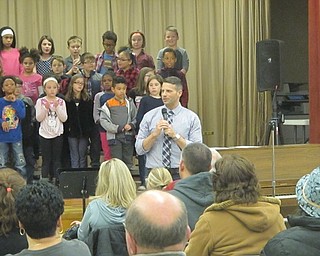 Neighbors | Zack Shively.Musical director Robert Pavalko spoke between pieces to discuss what the students had learned in each song. For example, the third grade learned pitch changes with “Rocky Mountain High“ by John Denver.