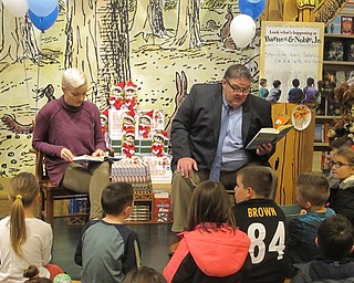 Neighbors | Zack Shively.Superintendent David Janofa and school conselor Lauren Mechling read a selection of “Wonder“ by Raquel J. Palacio at Dobbins Elementary School's book fair at Barnes and Noble in Boardman on Nov. 16.