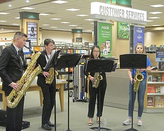 Neighbors | Zack Shively.Heather Trolio, PTO chair of the book fair, set up two performances during the night. Both the PSHS Saxophone Quartet and the PSHS A Cappella Ensemble performed in the middle of the store. Pictured are the members of the Saxophone Quartet, from left, Jack Brant, Noah Landry, Chelsea Kilgore and Merideth Lea.