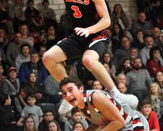 William D Lewis the vindicator Canfield's Ben Shapiro(3) keeps control of the ball as  Marlingtons Michael Huberty(3) flies over him during 11302017 action at Canfield.
