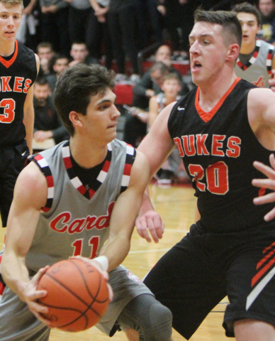 William D Lewis the vindicator Canfield's Spencer Woolley(11) passes past Marlingtons Brandon Stinson(20) during 11302017 action at Canfield.