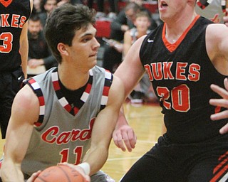 William D Lewis the vindicator Canfield's Spencer Woolley(11) passes past Marlingtons Brandon Stinson(20) during 11302017 action at Canfield.