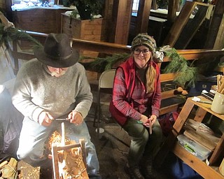 Neighbors | Zack Shively.The mill welcomed a number of artisans who gave live demonstrations of their work, such as a rock painter and a weaver. Pictured, Riverwood Trading Company's Gregg and Deb Kristophel carved spoons during the event. They also sold their crafts at the event.