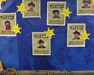 Neighbors | Abby Slanker.Wanted posters featuring C.H. Campbell Elementary School faculty and staff covered the walls of library for the school’s annual book fair with the theme ‘Wild West - Saddle up and Read’ on Nov. 15.