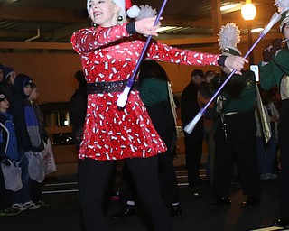 A twirler with the Ursuline High School Band performs during the annual Youngstown Christmas Parade and Tree lighting, Friday, Dec. 1, 2017, in downtown Youngstown...(Nikos Frazier | The Vindicator)