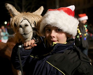 Members of the Llucky Llamas 4-H Club walk during the annual Youngstown Christmas Parade and Tree lighting, Friday, Dec. 1, 2017, in downtown Youngstown...(Nikos Frazier | The Vindicator)