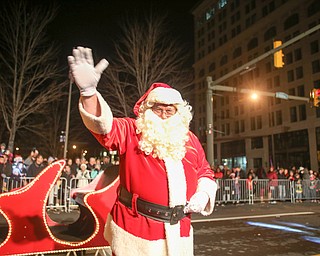 Santa arrives on Federal St. during the annual Youngstown Christmas Parade and Tree lighting, Friday, Dec. 1, 2017, in downtown Youngstown...(Nikos Frazier | The Vindicator)