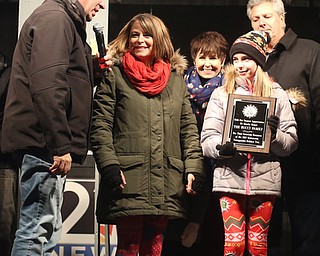 Members of the Bucci family are honored for their blue spruce Christmas tree donation during the annual Youngstown Christmas Parade and Tree lighting, Friday, Dec. 1, 2017, in downtown Youngstown...(Nikos Frazier | The Vindicator)
